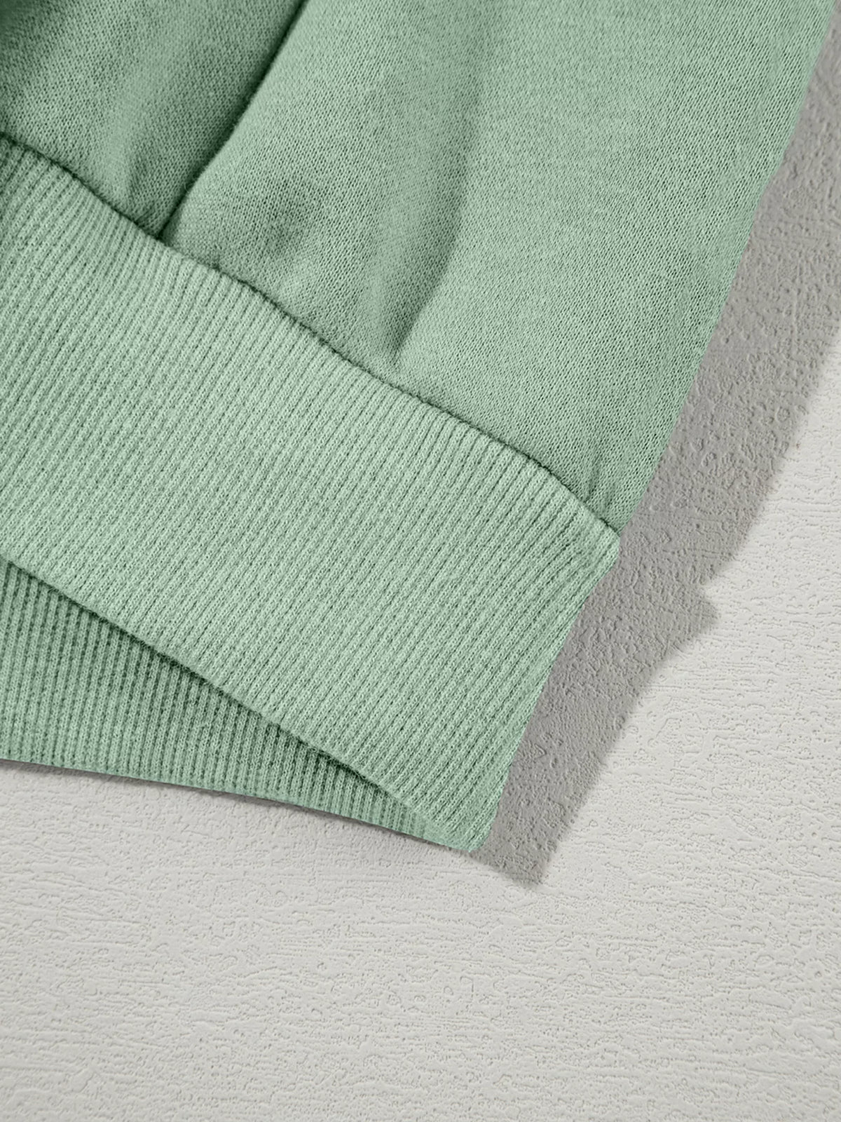Women's Zip Up Jogger Set in Sage on model showing pockets