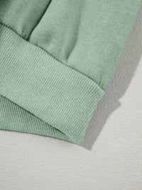 Women's Zip Up Jogger Set in Sage on model showing pockets