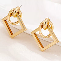18K Gold Geometric Square Hoop Earrings displayed on a white background, showcasing their minimalist geometric design.