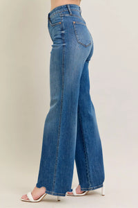 High Waist Tummy Control Jeans with Destroyed Hem on a plus-size model.