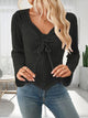 Women’s ruched drawstring ribbed long sleeve top in beige, styled with jeans for casual fall outfit