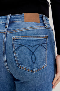 Plus Size Judy Blue Cuffed Jeans in a mid-rise, classic fit shown on a model.