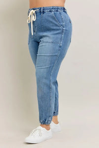 Judy Blue High Waist Denim Jogger in blue wash on model