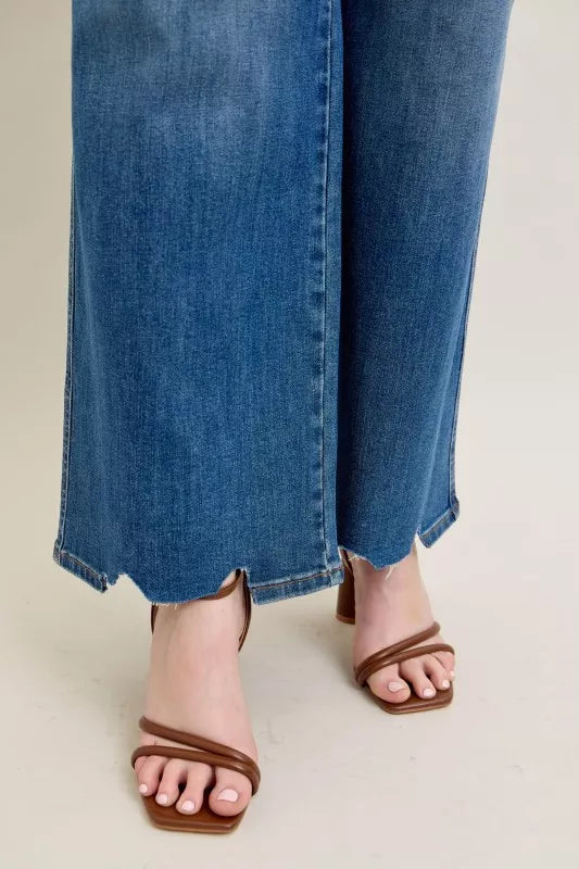 High Waist Tummy Control Jeans with Destroyed Hem on a plus-size model.