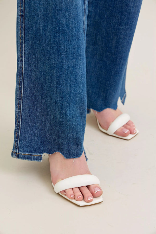 High Waist Tummy Control Jeans with Destroyed Hem on a plus-size model.