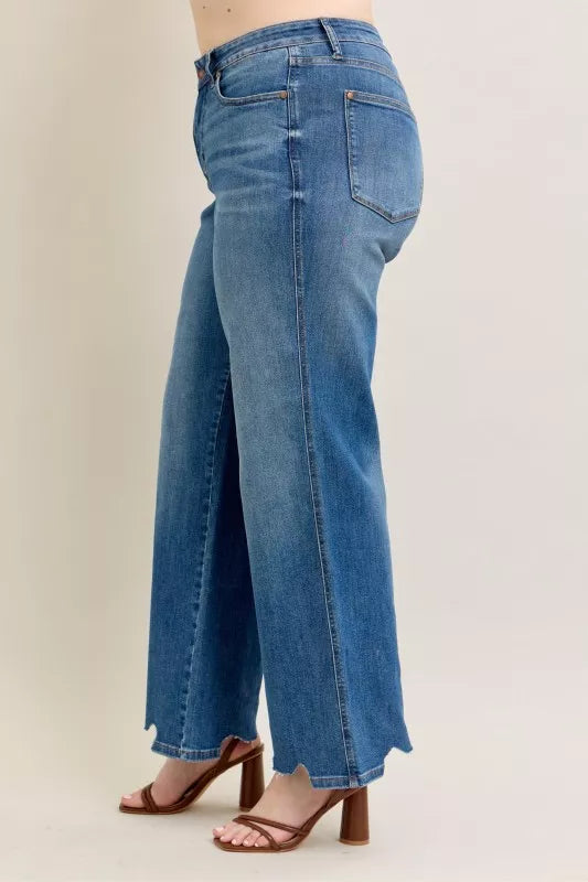 High Waist Tummy Control Jeans with Destroyed Hem on a plus-size model.