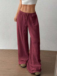 Women's plus size cotton drawstring wide leg pants in Wine Red, showing relaxed fit and tie waist.