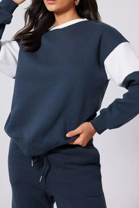 Women's Oversized Loungewear Set in Navy, featuring a drop-shoulder sweatshirt and matching joggers on a model.