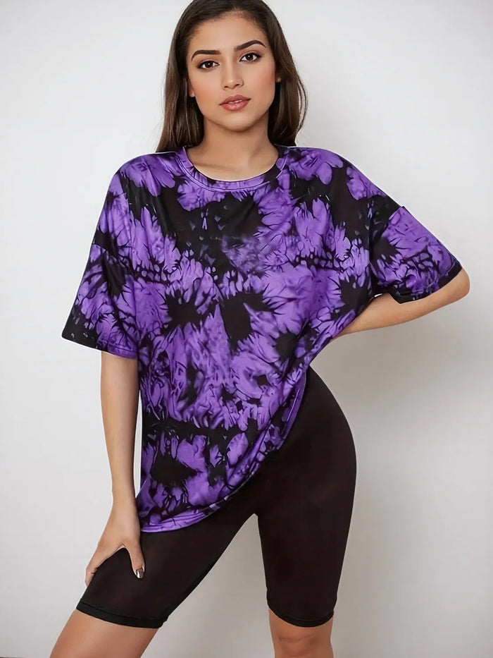 Women's Tie-Dye Short Sleeve T-Shirt in a vibrant blue and purple swirl pattern on a mannequin