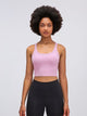 Athletic woman wearing a breathable workout tank top during yoga session
