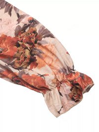 Close-up of smocked bodice and floral print on viscose dress