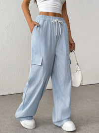Drawstring Striped Wide Leg Cargo Pants in Light Blue shown on a model, featuring side stripes and large cargo pockets.