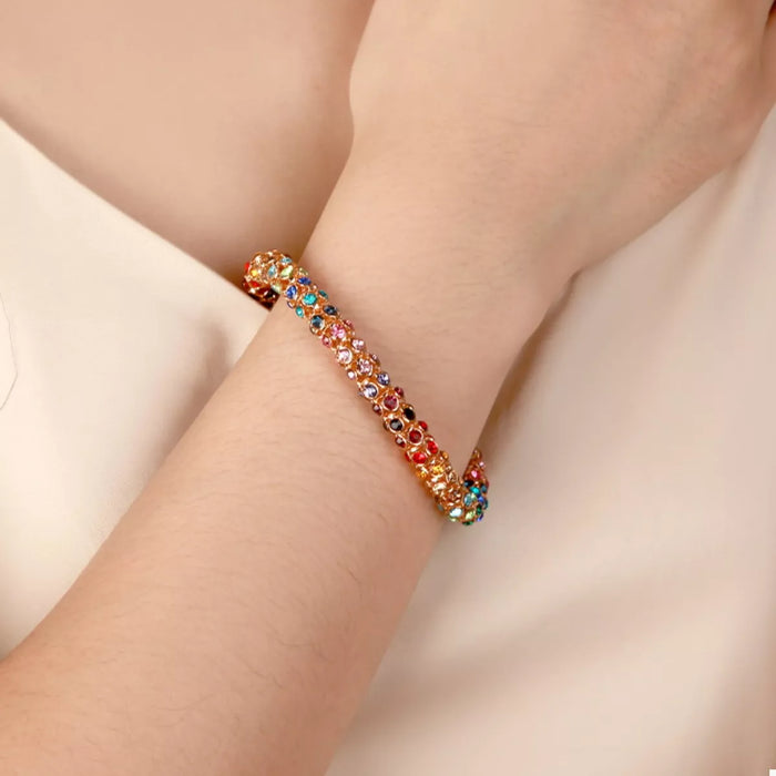 Rainbow Crystal Bracelet showcasing dainty gold chain with multicolored crystals.