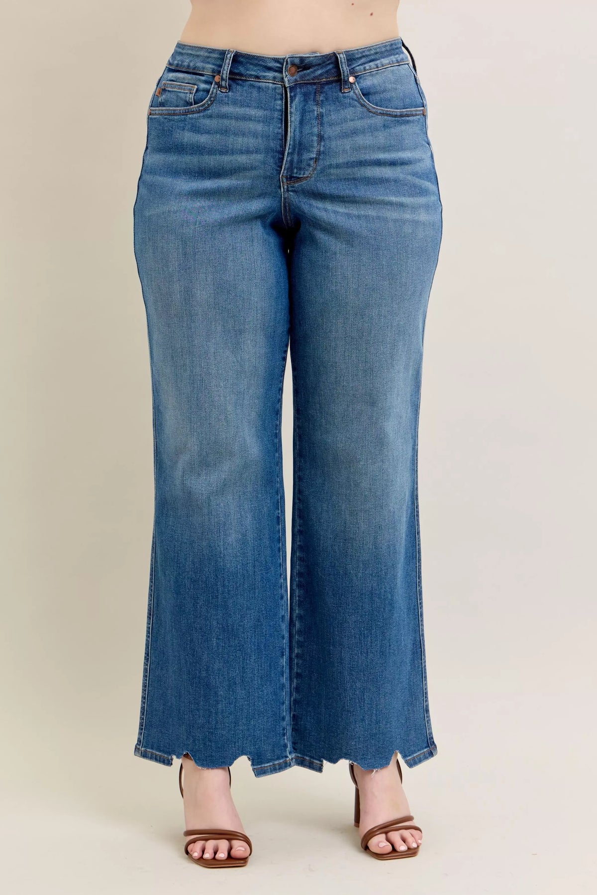 High Waist Tummy Control Jeans with Destroyed Hem on a plus-size model.