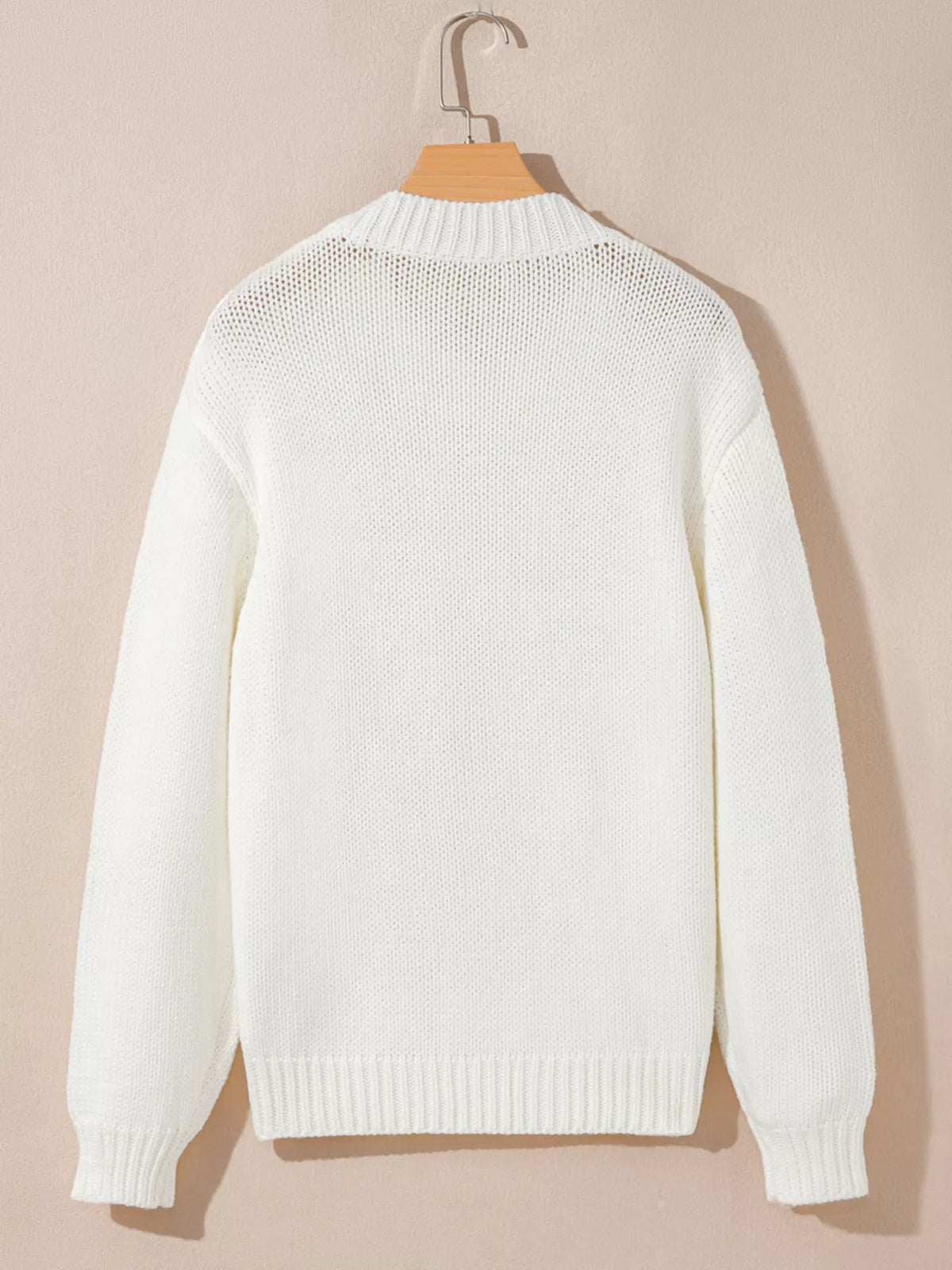 Women's Embroidered Bow Boots Drop Shoulder Sweater in cream, laid flat showing the detailed boot and bow design on the front.