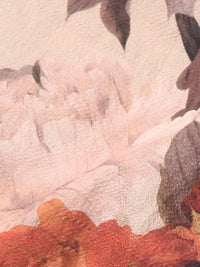 Close-up of smocked bodice and floral print on viscose dress