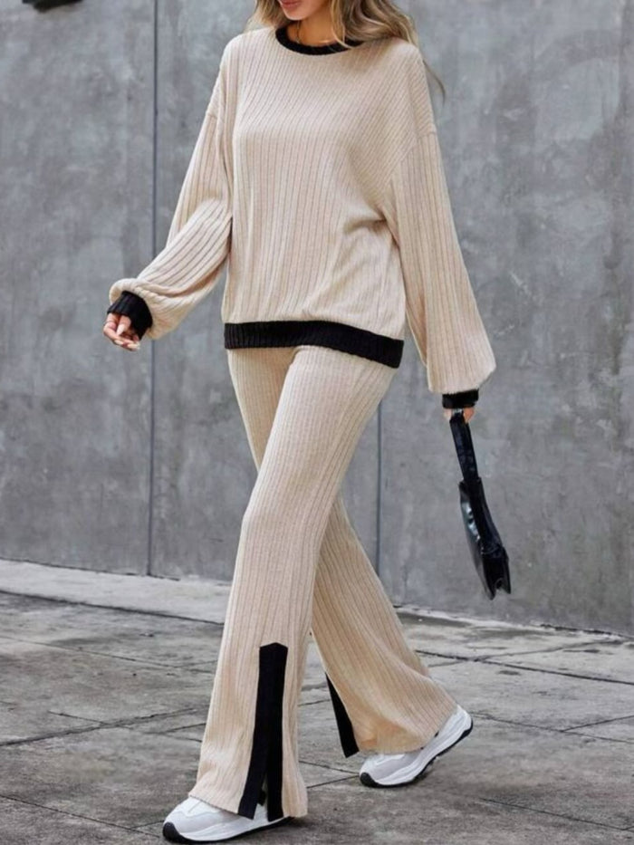 A stylish contrast round neck long sleeve top paired with bootcut pants. The top features a solid color with a round neckline and long sleeves, while the bootcut pants have a flared leg design, creating a chic and modern outfit.