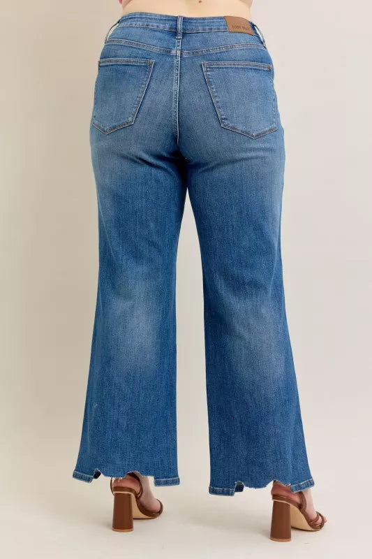 High Waist Tummy Control Jeans with Destroyed Hem on a plus-size model.