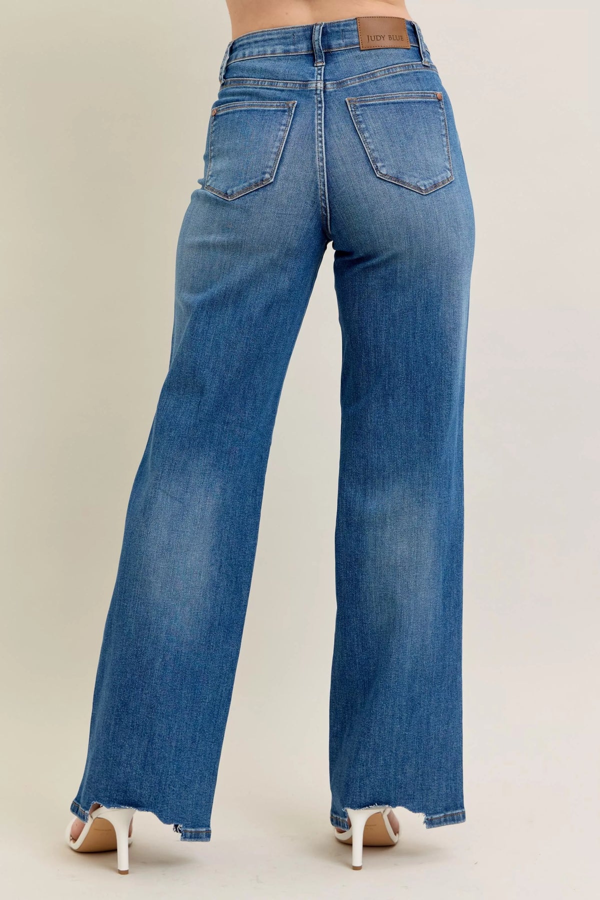 High Waist Tummy Control Jeans with Destroyed Hem on a plus-size model.