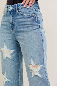 Judy Blue 90s Straight Jeans in a distressed wash, modeled from the front, showing the high waist and straight leg fit.
