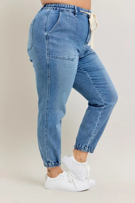 Judy Blue High Waist Denim Jogger in blue wash on model