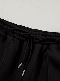 Women's Zip Up Jogger Set in Black on model showing pockets