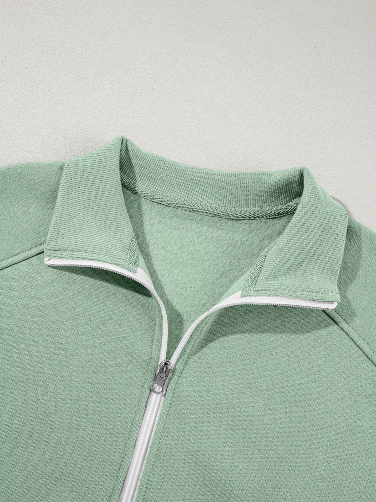 Women's Zip Up Jogger Set in Sage on model showing pockets