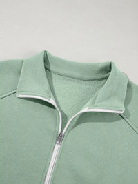 Women's Zip Up Jogger Set in Sage on model showing pockets