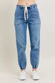 Judy Blue High Waist Denim Jogger in blue wash on model