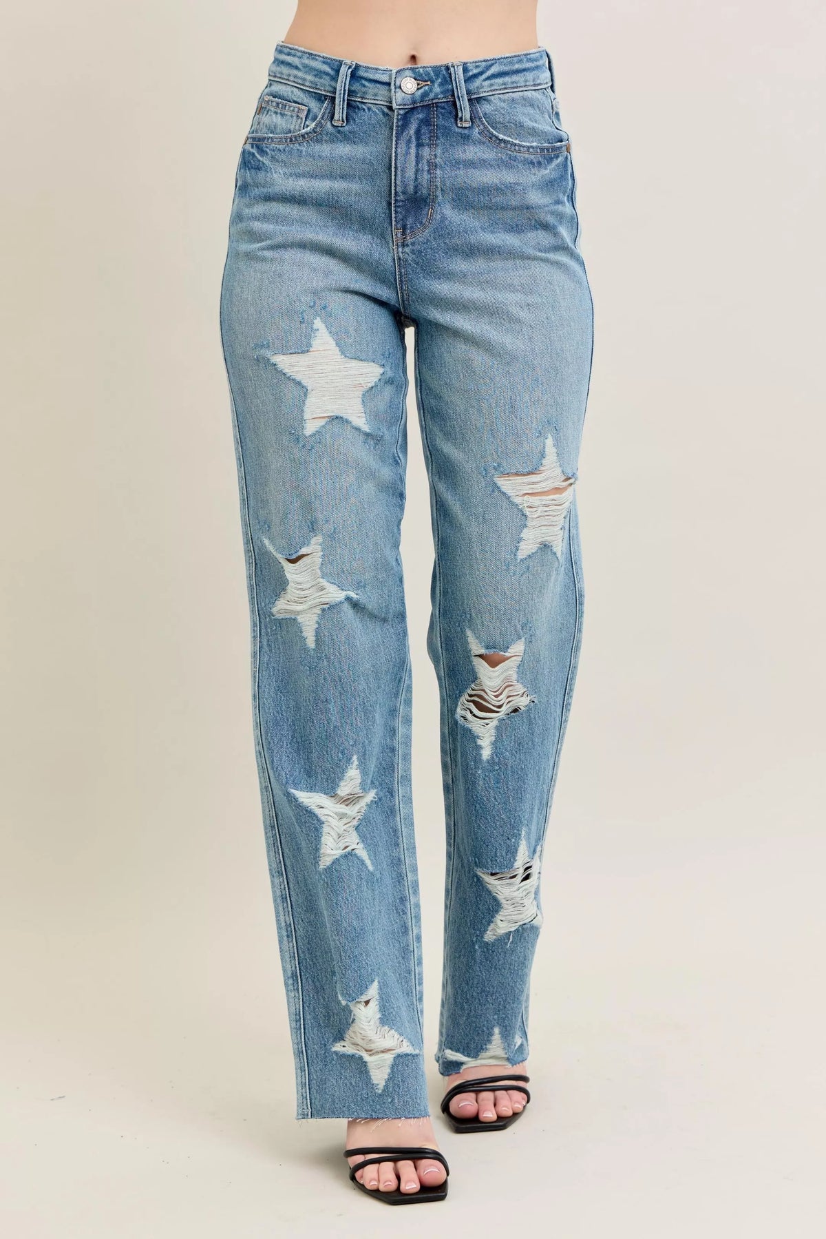 Judy Blue 90s Straight Jeans in a distressed wash, modeled from the front, showing the high waist and straight leg fit.