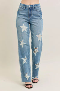 Judy Blue 90s Straight Jeans in a distressed wash, modeled from the front, showing the high waist and straight leg fit.