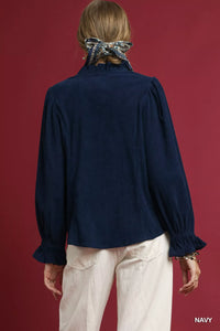 Back view of women's button down corduroy ruffle shirt