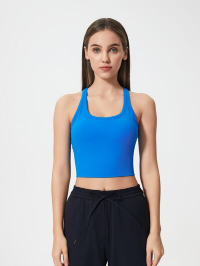 Athletic woman wearing a breathable workout tank top during yoga session
