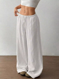Women's plus size cotton drawstring wide leg pants in White, showing relaxed fit and tie waist.
