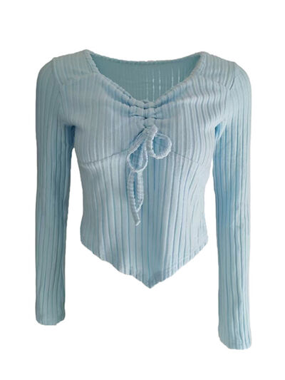 Women’s ruched drawstring ribbed long sleeve top in beige, styled with jeans for casual fall outfit