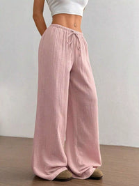 Women's plus size cotton drawstring wide leg pants in Pink, showing relaxed fit and tie waist.