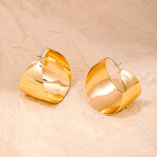 Wide Gold Hoop Earrings for Women displayed on a model.