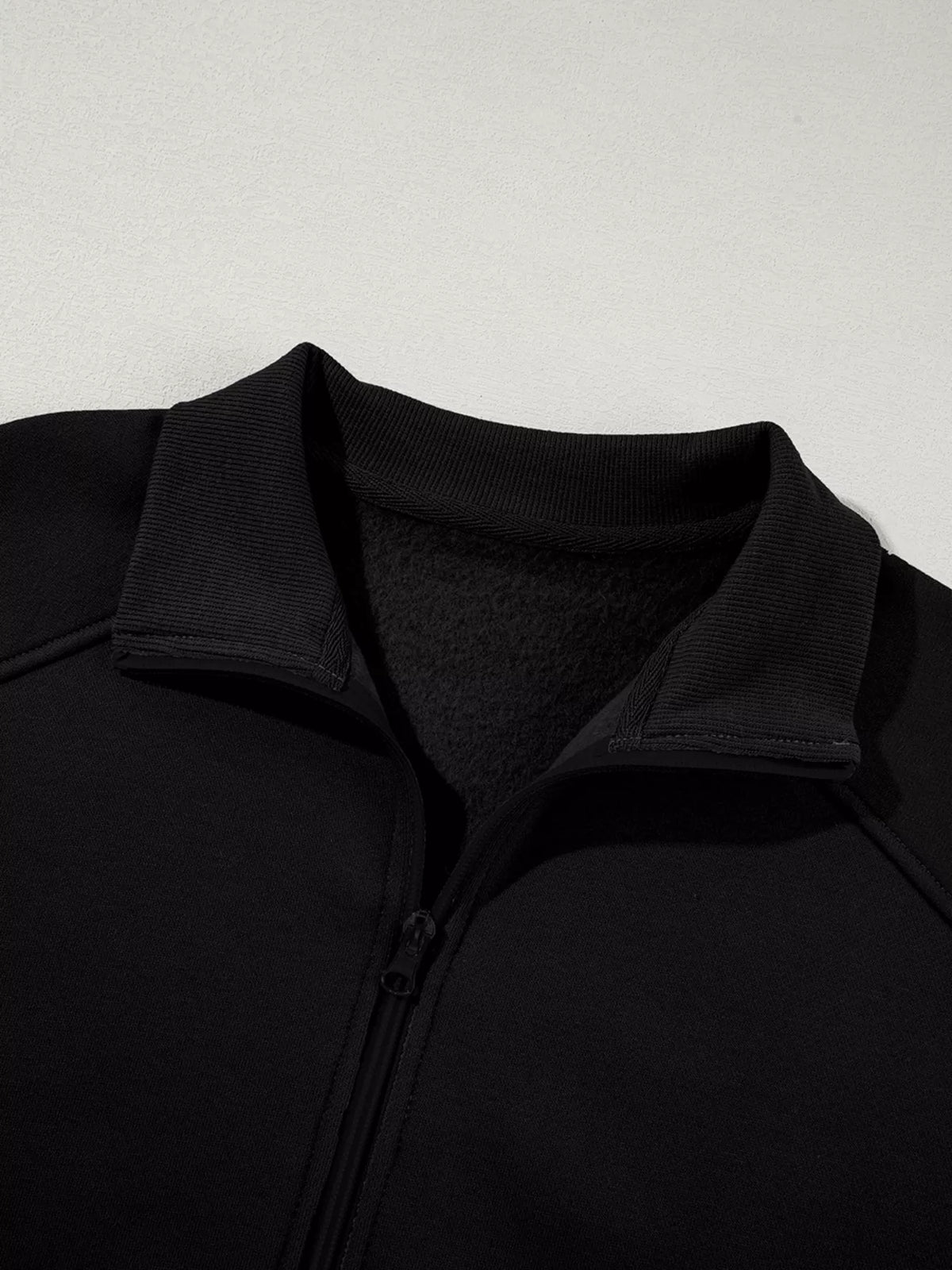 Women's Zip Up Jogger Set in Black on model showing pockets