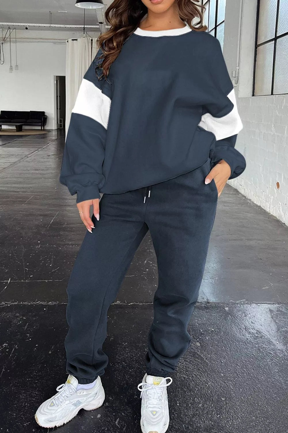 Women's Oversized Loungewear Set in Navy, featuring a drop-shoulder sweatshirt and matching joggers on a model.