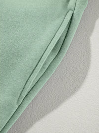 Women's Zip Up Jogger Set in Sage on model showing pockets