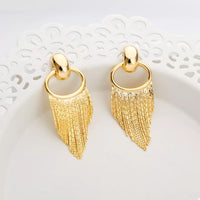 18K Gold Plated Fringe Chain Earrings dangling from a model's ear, showcasing the elegant gold finish and dynamic movement.