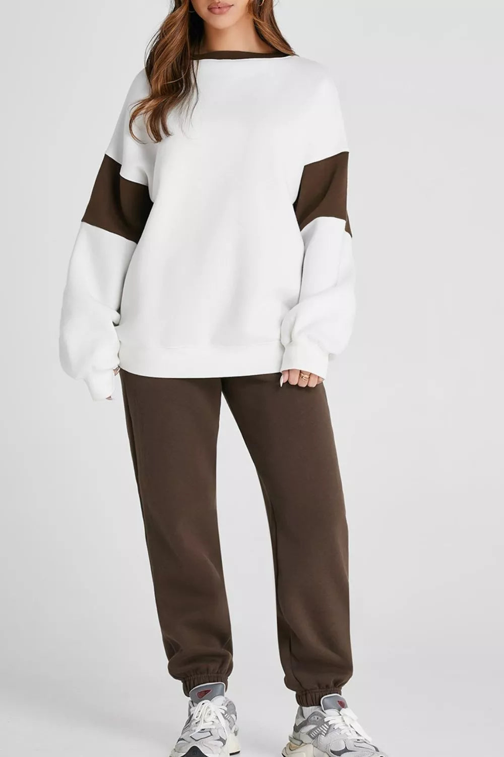Women's Oversized Loungewear Set in White, featuring a drop-shoulder sweatshirt and matching joggers on a model.