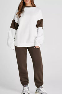 Women's Oversized Loungewear Set in White, featuring a drop-shoulder sweatshirt and matching joggers on a model.