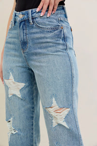 Judy Blue 90s Straight Jeans in a distressed wash, modeled from the front, showing the high waist and straight leg fit.