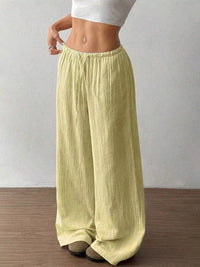 Women's plus size cotton drawstring wide leg pants, showing relaxed fit and tie waist.