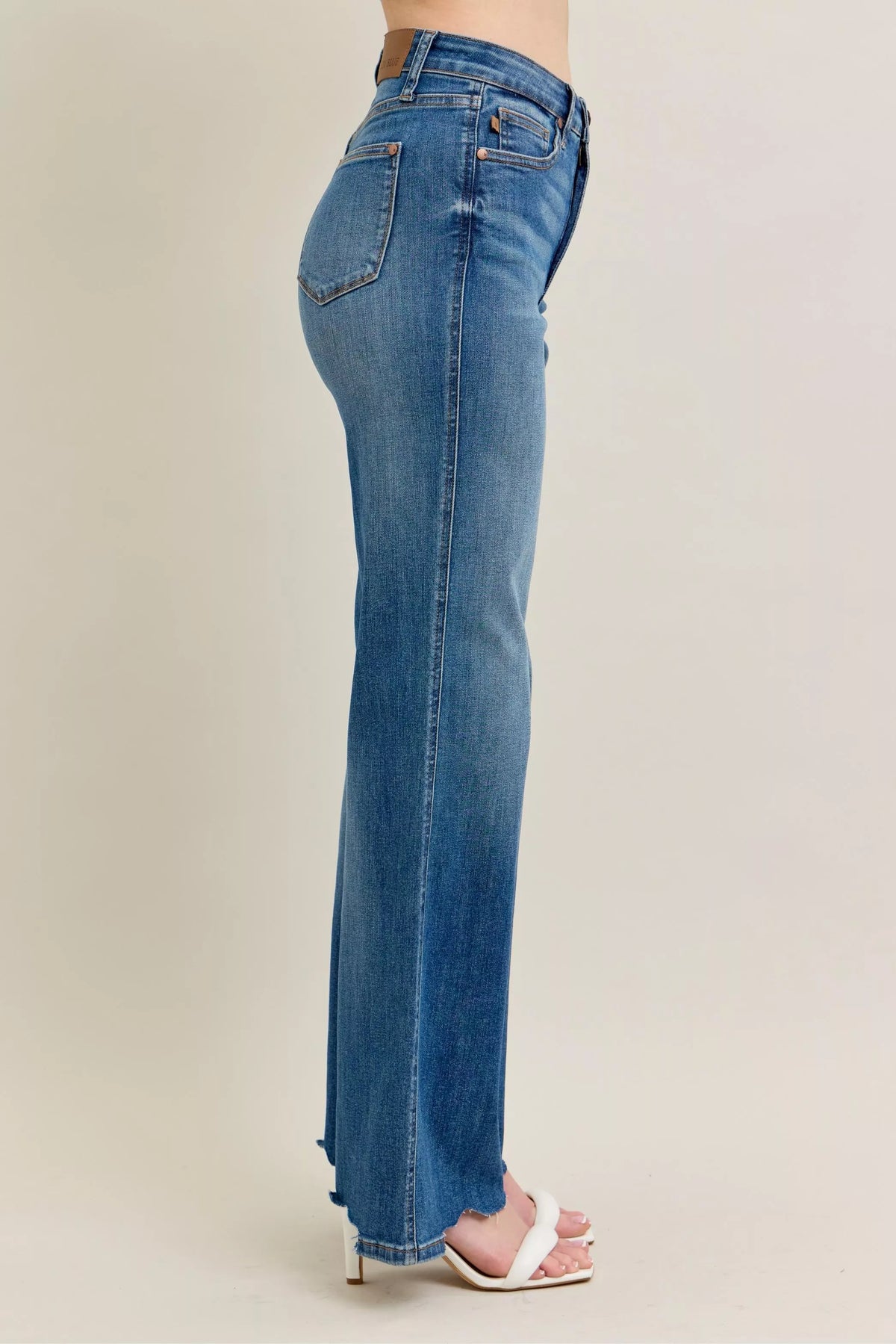High Waist Tummy Control Jeans with Destroyed Hem on a plus-size model.