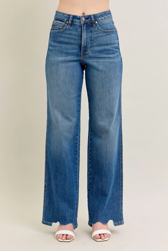 High Waist Tummy Control Jeans with Destroyed Hem on a plus-size model.