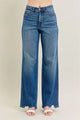 High Waist Tummy Control Jeans with Destroyed Hem on a plus-size model.