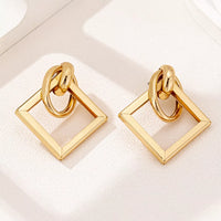 18K Gold Geometric Square Hoop Earrings displayed on a white background, showcasing their minimalist geometric design.