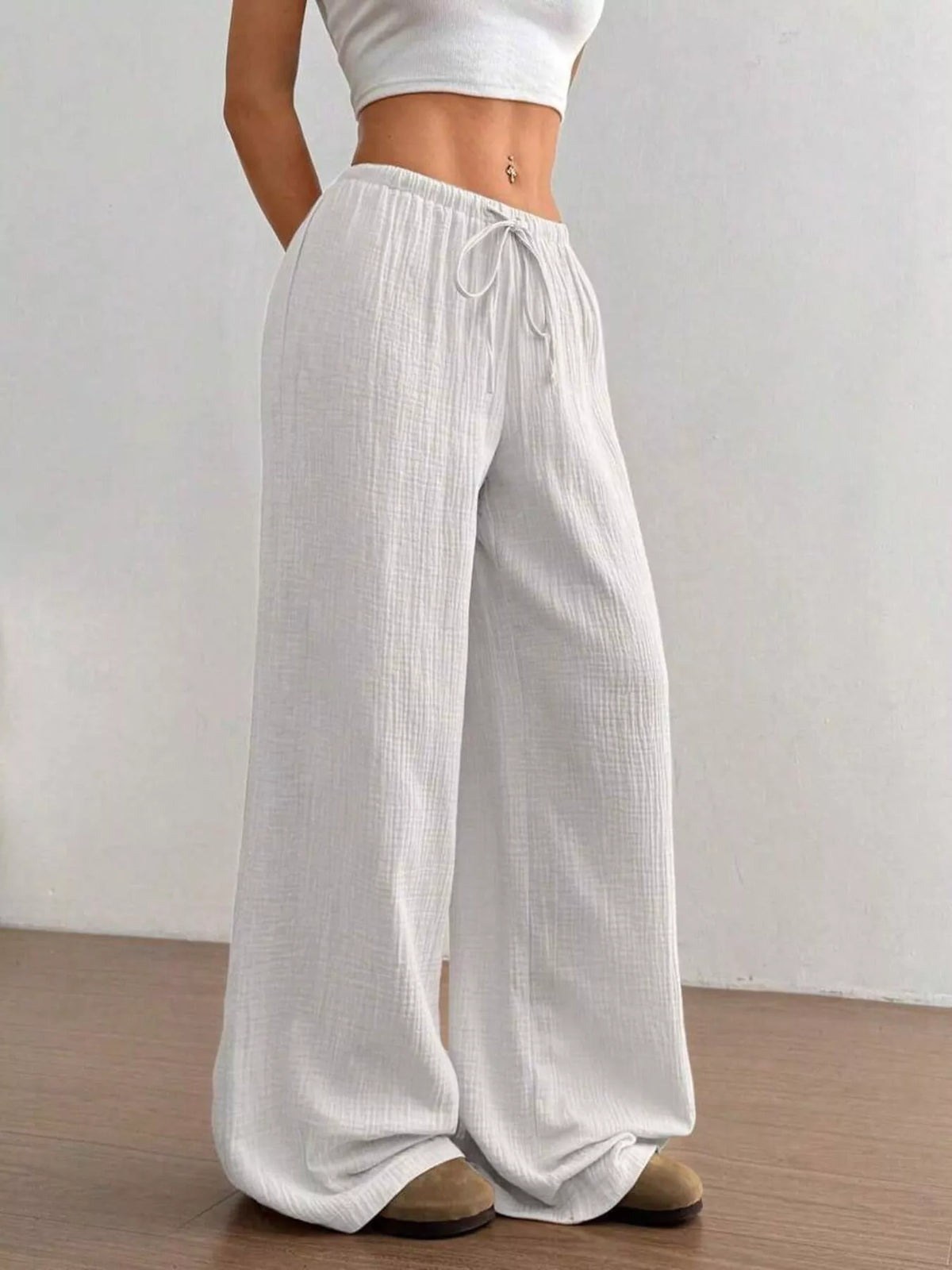 Women's plus size cotton drawstring wide leg pants in White, showing relaxed fit and tie waist.